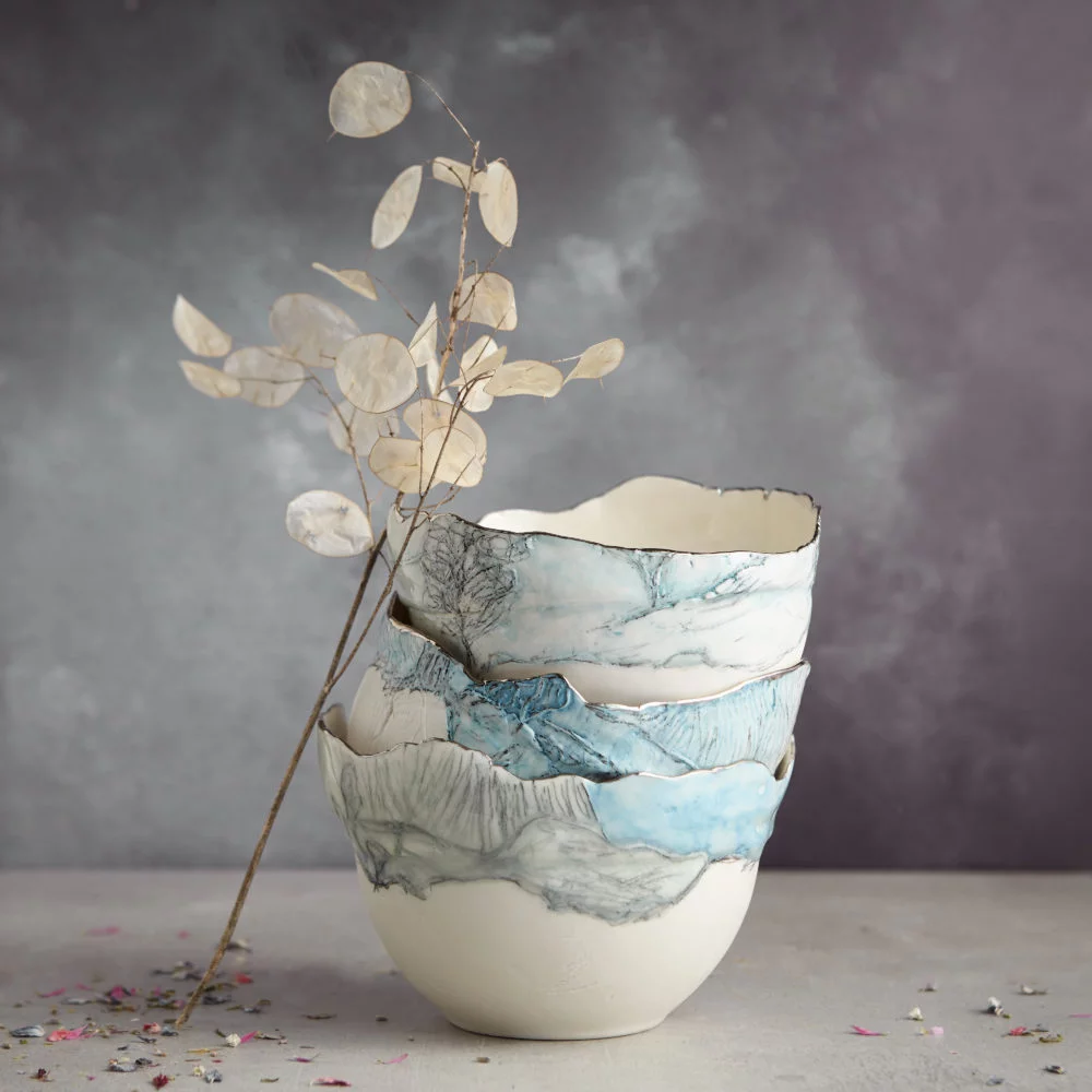 Beautiful Porcelain Landscape Bowls stacked up in a pile by Nicola Briggs Ceramics & Art
