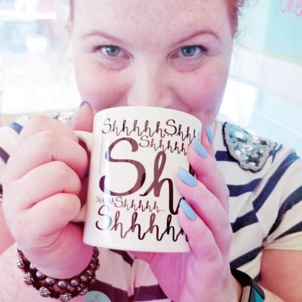 Fay drinnking from a 'sshhhh' mug
