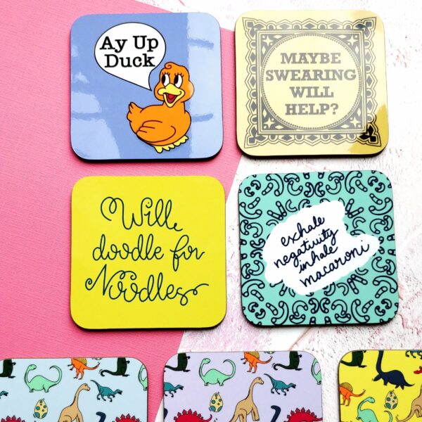 Collection of coasters, including dinosaurs, Ay up Duck, will doodle for noodles and exhale negativity, inhale macaroni