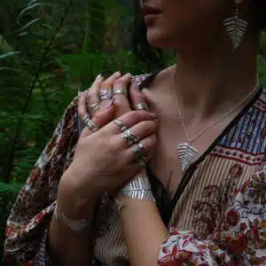 Our model wears Rooks & Roses fern collection; handmade silver jewellery.