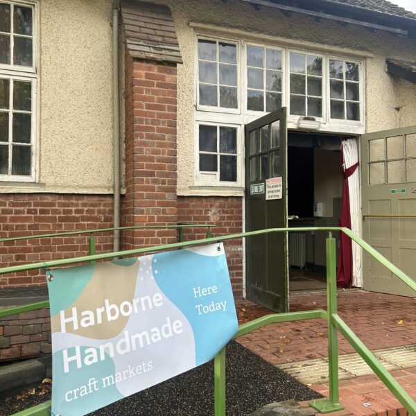 The side door of Moor Pool Hall with a permanent disabled access ramp