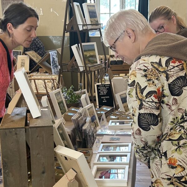 People browsing a stall at Harborne Handmade craft markets