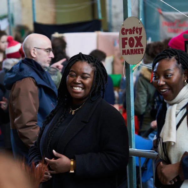 smiling traders at busy crafty fox market