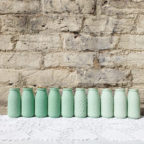 Green porcelain carved bottle vases by Clara Castner