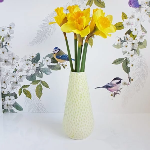 Charlotte vase with lime green glaze and daffodils by Clara Castner