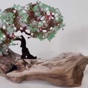 Stiltwalkers Stuff, fused glass tree with pale pink blossom mounted on driftwood