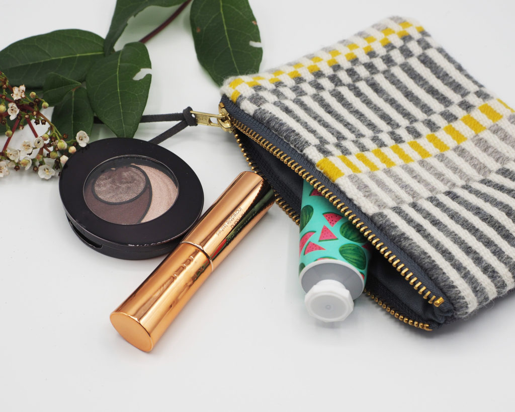 Handmade striped purse for makeup storage