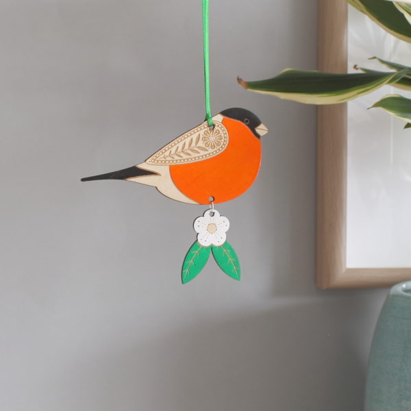 Hanging wooden bullfinch decoration with flower