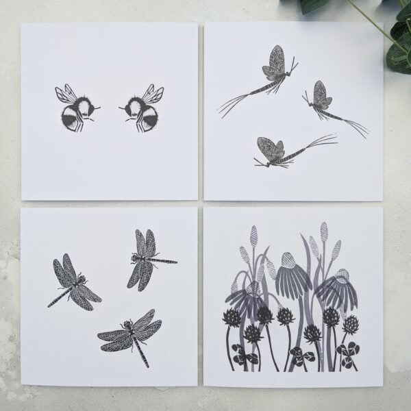 Rose and Hen, 4 greetings cards in black and white. One with two bees facing each others, one with two mayflies, one with three dragonflies and one of meadow grass, daisies and clover.