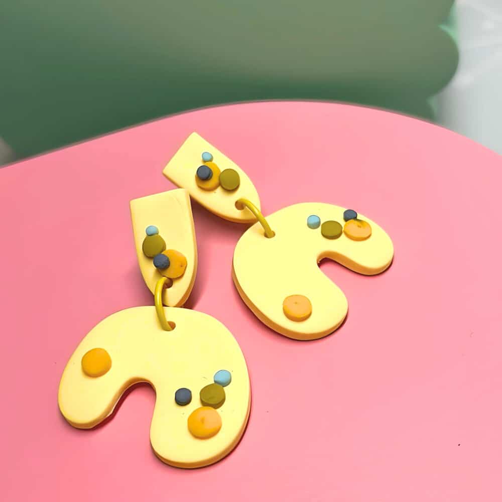 the argentum design company polymer clay earrings, 3d dots on organic u shapes