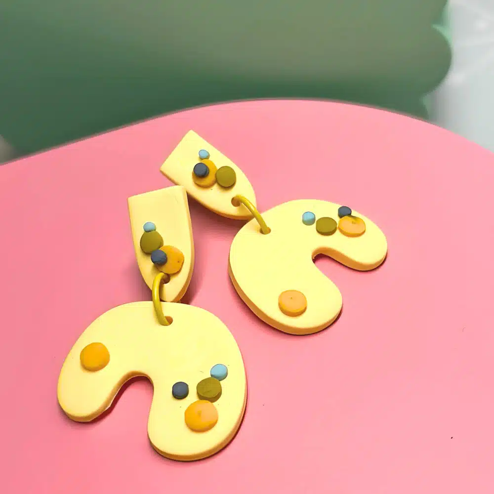 the argentum design company polymer clay earrings, 3d dots on organic u shapes