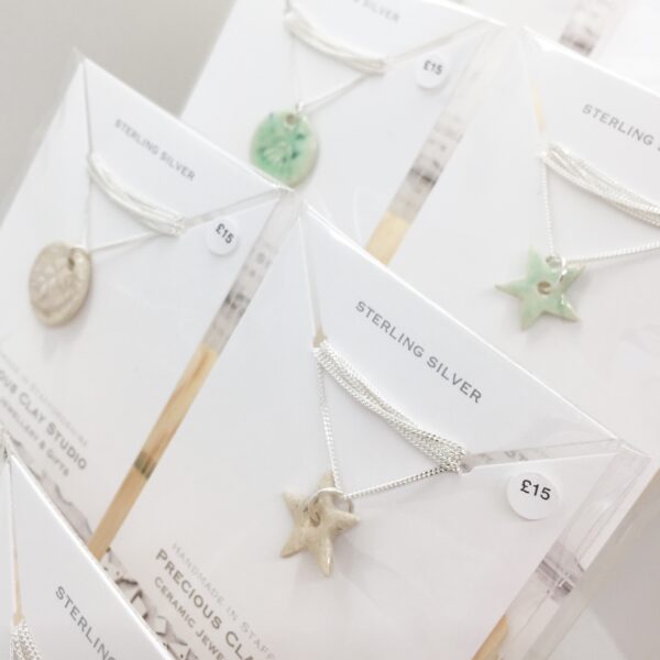 Precious Clay Studio ceramic star necklaces mint green and creamy oatmeal