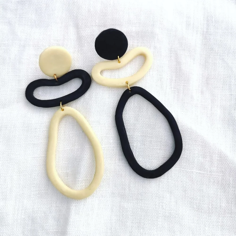 Audrey and george nude and black topsy turvy hoop mismatched polymer clay earrings