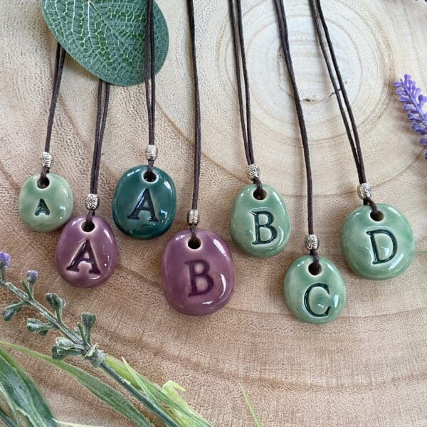 ceramic initial pendants by Laurel Tree Pottery