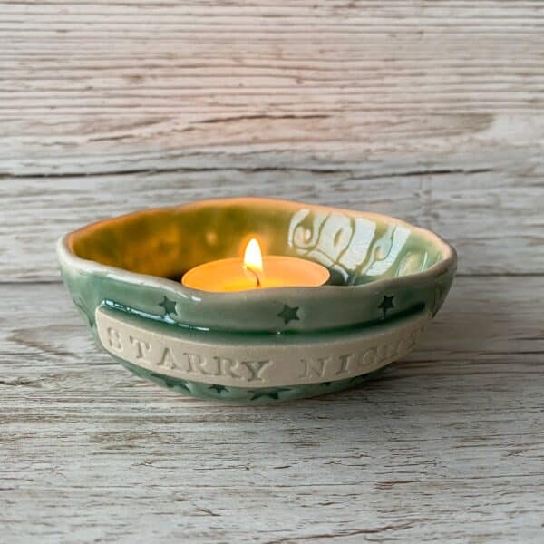 starry night ceramic candle holder with embossed stars design, made by Laurel Tree Pottery