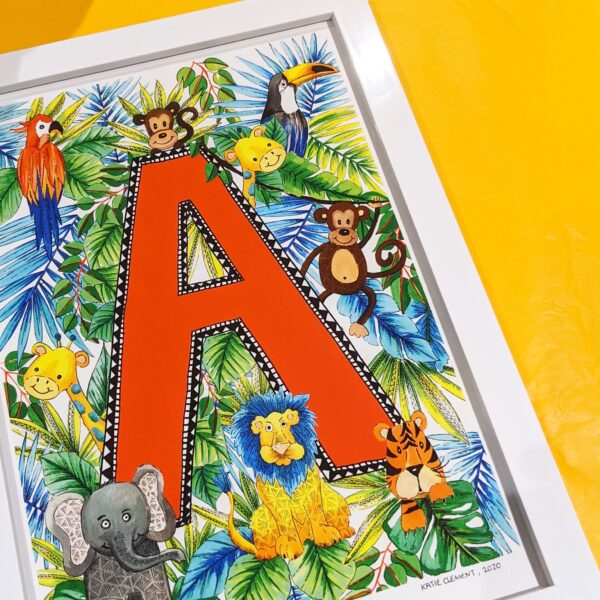 Katie Clement Illustration, a framed A4 letter A Children's Jungle Initial Art Print lays flat on some yellow tissue paper