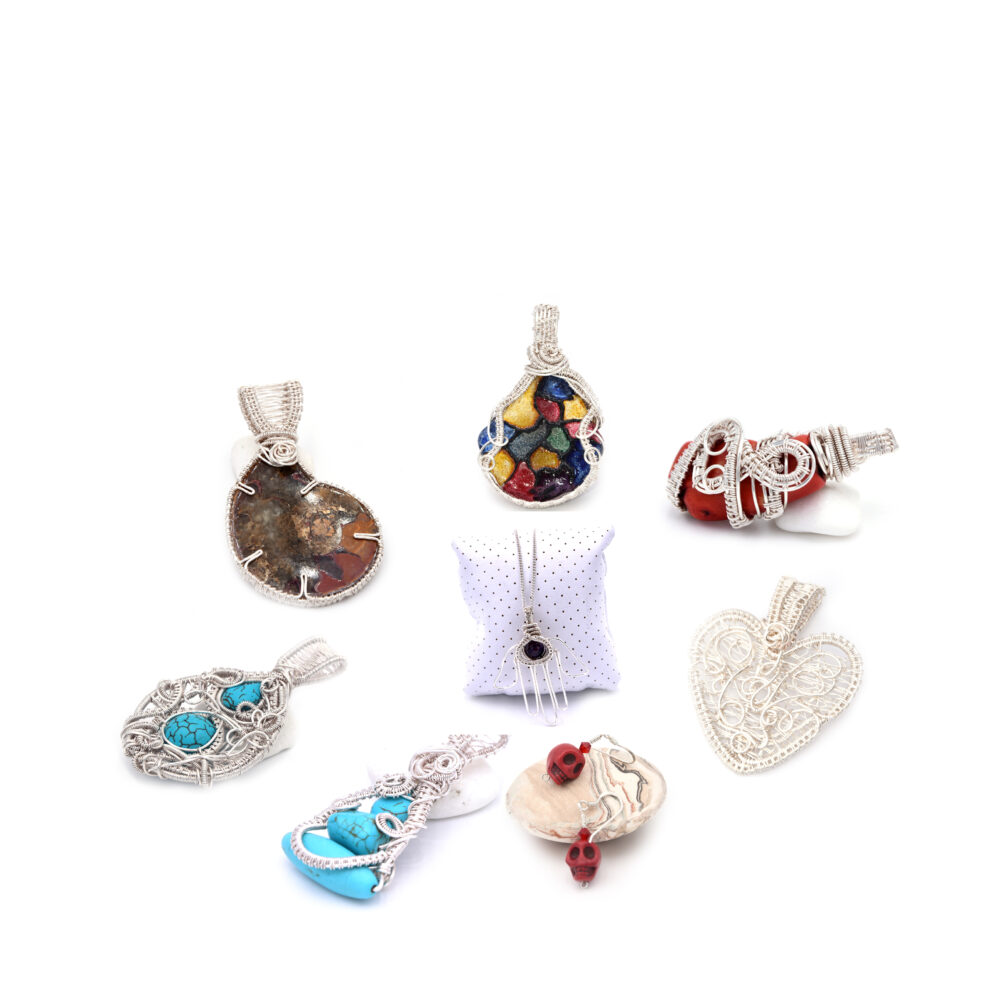 multiple images of my sire wrapped pendandts showcasing the style of my work