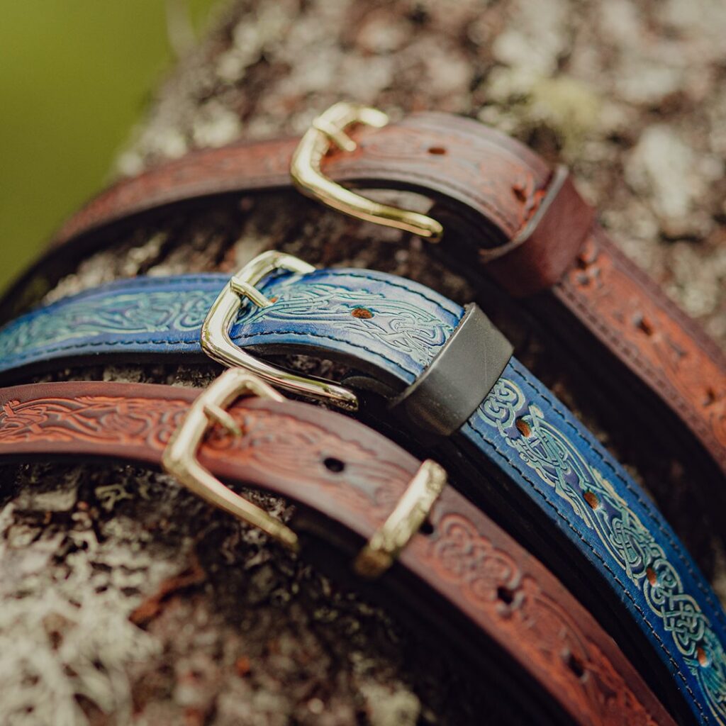 Embossed leather belts in blue and brown