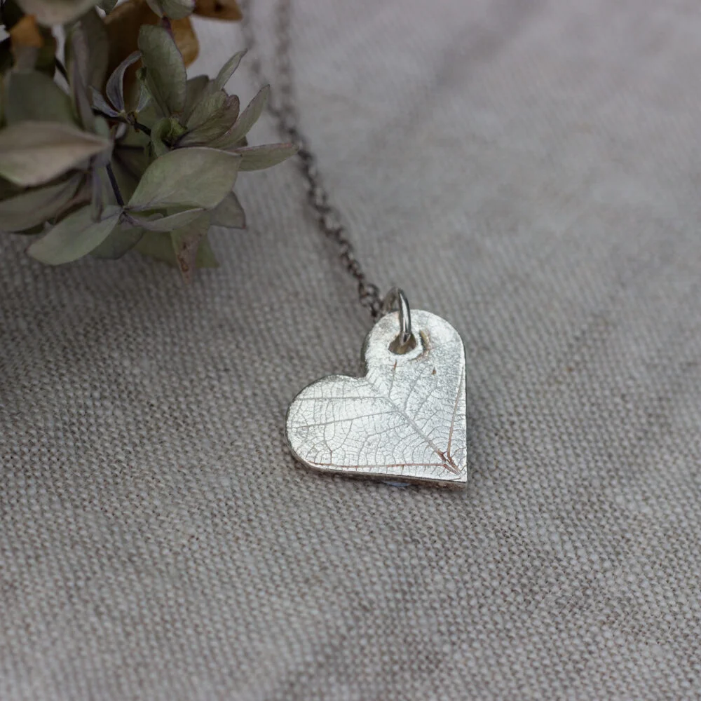 The Little red hen eco silver heart shaped pendant with leaf pattern