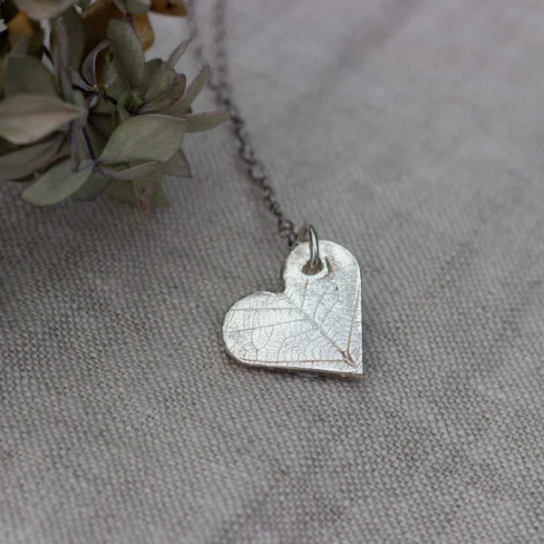 The Little red hen eco silver heart shaped pendant with leaf pattern