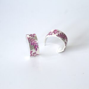 Fine silver half hoops handmade earrings with purple resin flower details.