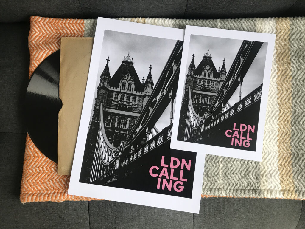 Almond Creative, the clash London Calling art print. Black and white image of a bridge with pink text that says LDN Calling
