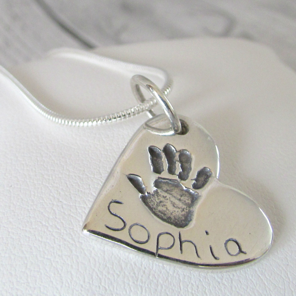 true love keepsakes, heart handprint charm necklace made from pure silver personalised with a name