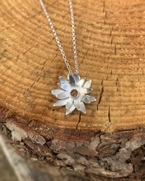 Sparkle by Faith, hand cut sterling silver daisy pendant with a central set amber gemstone