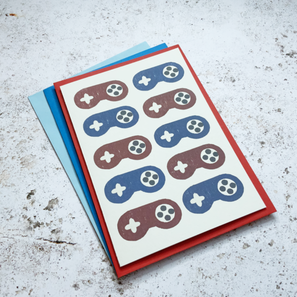 Fussy Geek Wares, SNES red & blue contollers greetings card