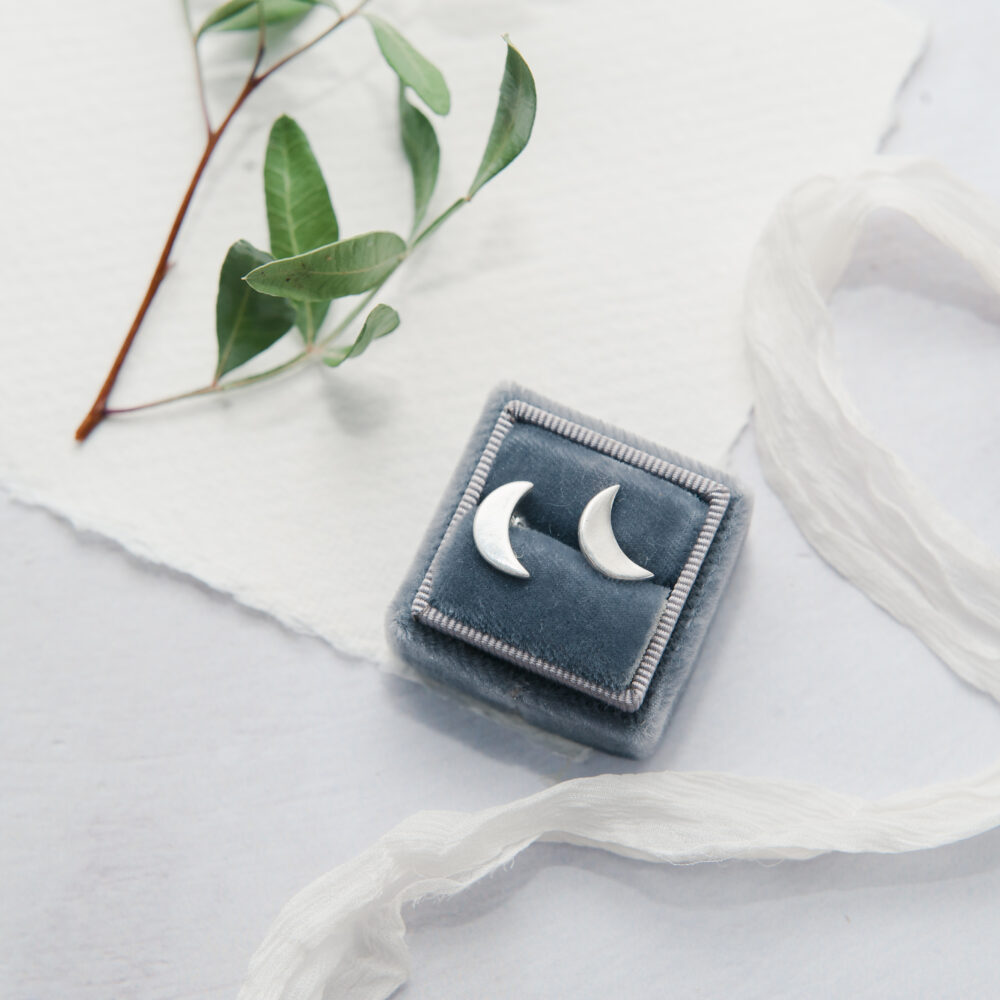 Upside Down Tree Studio, half moon stud earrings in a blue vintage box with an olive leaf