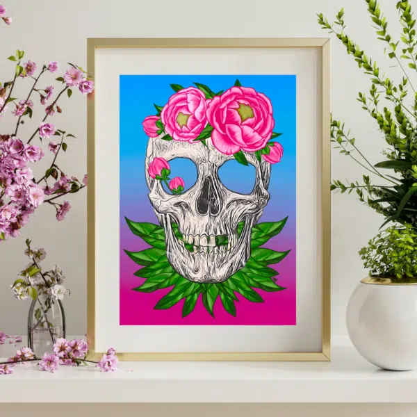 Framed art print of a skull covered in pink peonies. Tattoo art style. The background of the art print is a gradient from blue to pink.