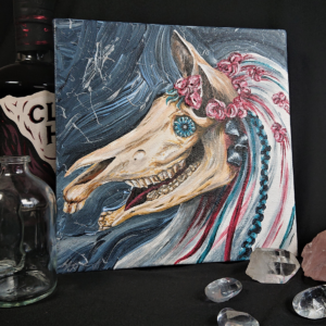Mari Lwyd Canvas by Hannah Kate Makes. An original acrylic on canvas painting of the Welsh wassailing folk lore creature. A horse's skull adorned with flowers and a glass bottle-bottom eye.