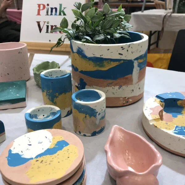 PinkVine, Photo of some items from the Summer Collection. Homeware in a palette of bright, primary blue, terracotta, mustard and off white with textural elements