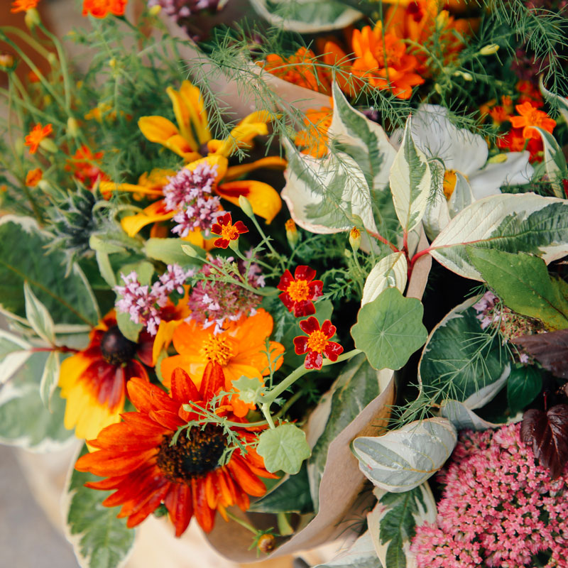 Beautiful fresh flowers in front of market stall