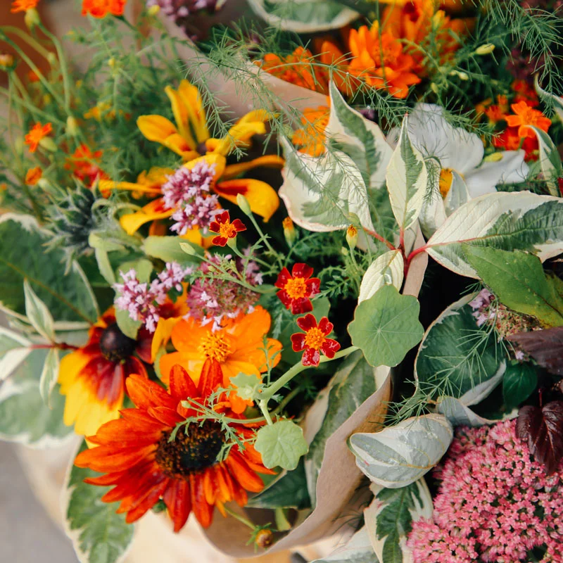 Beautiful fresh flowers in front of market stall