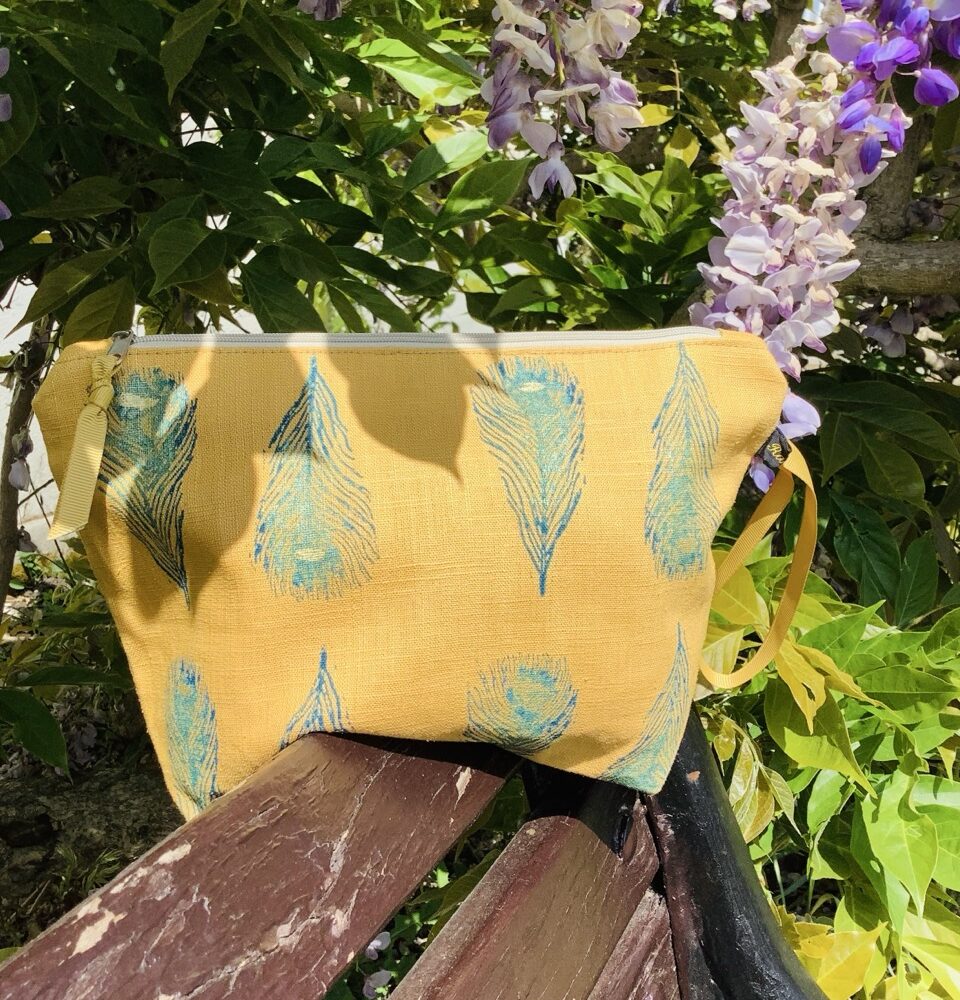 Raina Atelier Yellow Peacock Feathers Linen Makeup Bag and Raina Atelier Yellow Linen Peacock Feathers Zip-Up Pouch