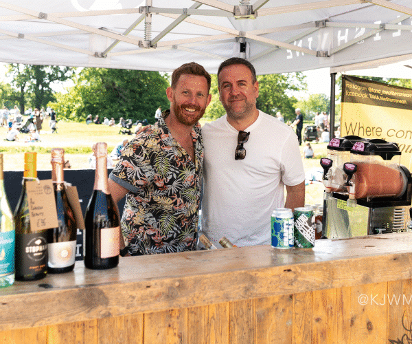 The English Vine booth guys smiling at the camera.