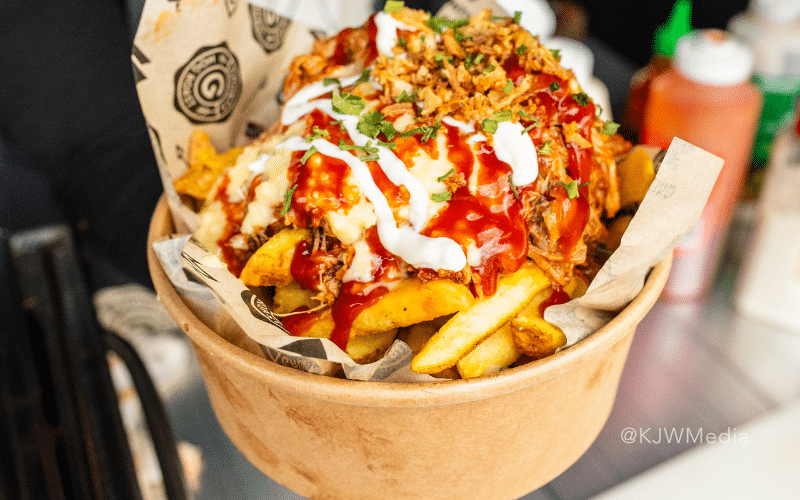A close up of loaded fries.