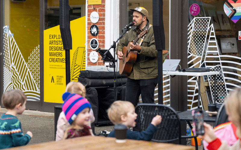 Live music being played by a guitarist at The Stables at Hylands Estate.