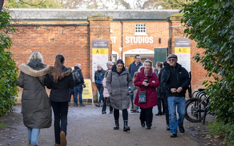 Visitors walking into and out of The Stables at Hylands Estate.