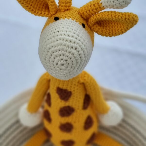 Amaris and Chaya orange and white crochet giraffe toy