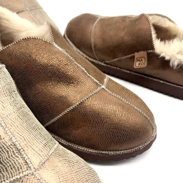 Sheepskin slippers with a textured metallic finish.
