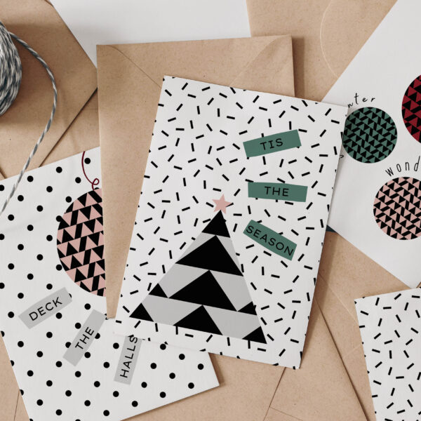 Selection of geometric Christmas cards with Kraft brown envelopes and twine