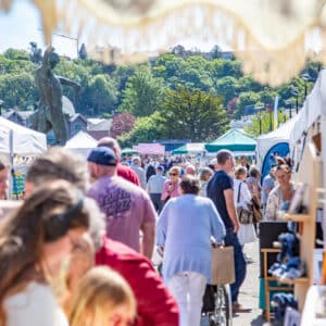 Sunny bustling street market scene in Truro, Cornwall
