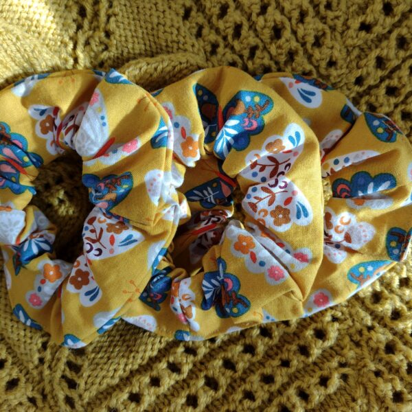 Mustard floral scrunchies on a mustard background