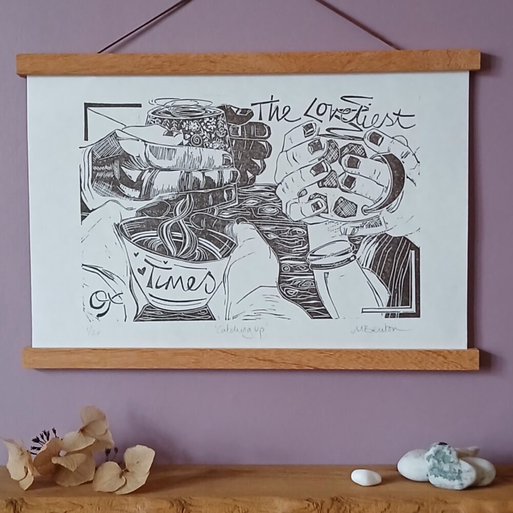 Mandy Benton Printmaker, 'Catching Up' Linocut Print. A print on a lovely 'Hosho' paper depicting the hands of three friends cradling mugs of hot drinks.