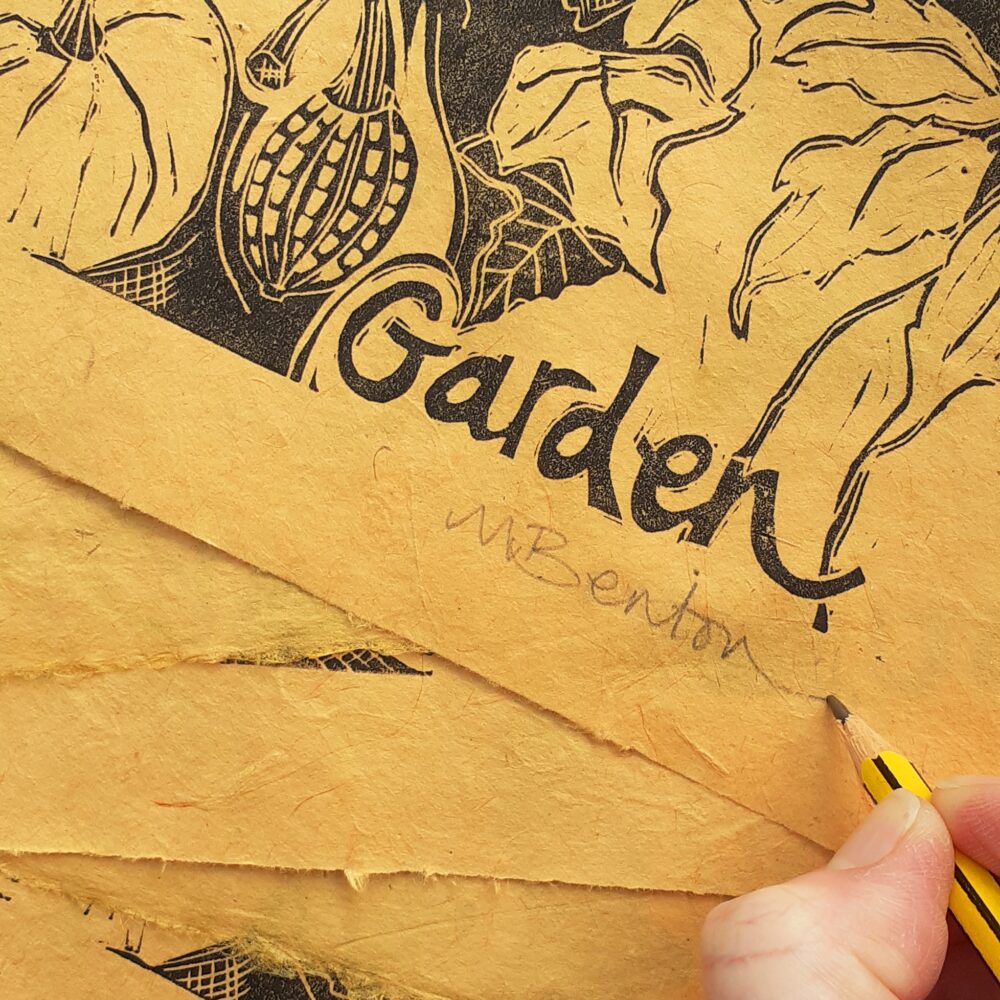 Mandy Benton Printmaker - Editioning 'September in the Garden'. Linocut print in black ink on a beautiful handmade saffron coloured Nepalese paper.