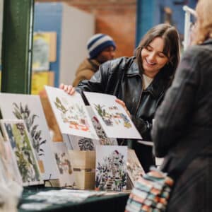 Artist with work at Makers Market