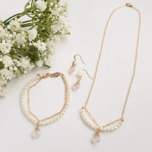 Watermeadow Lane jewellery consisting of necklace, bracelet and earrings made with gold chain, freshwater pearls and rose quartz