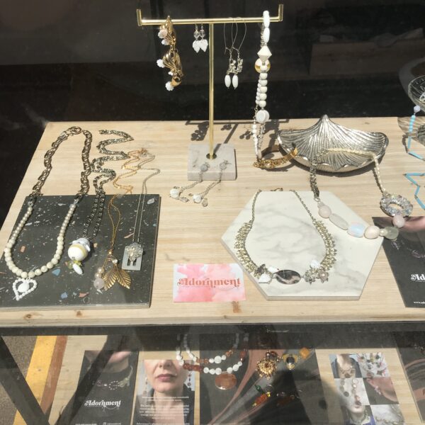 Image shows Adornment jewellery laid out in a pop up store in the style of a market stall